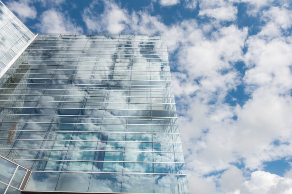 Bottom View of Clear Glass Building Under Blue Cloudy Sky during Day Time demonstrating ethical web design